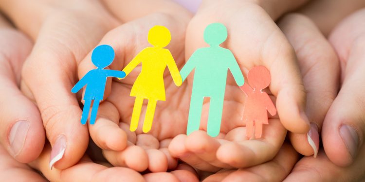 Paper family in hands